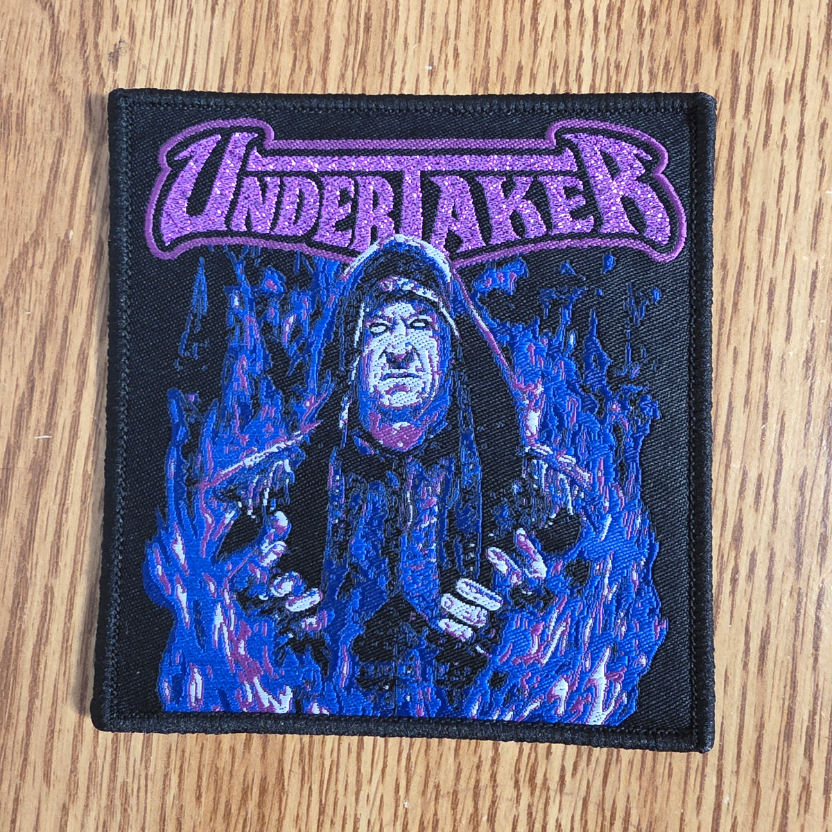Undertaker Purple Glitter Logo