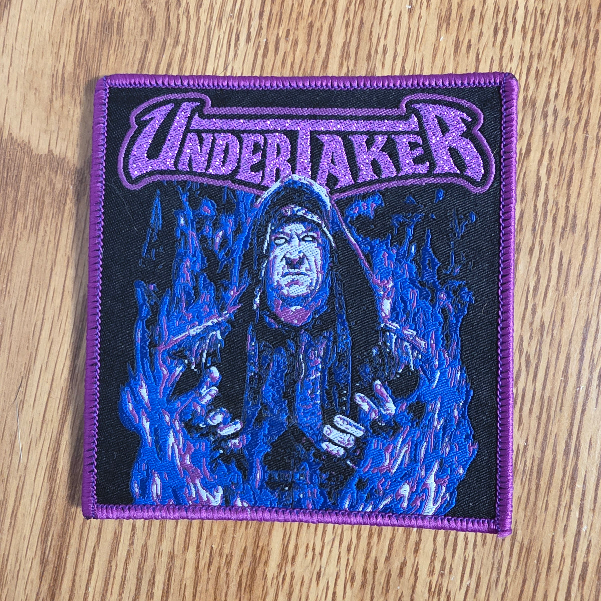 Undertaker Purple Glitter Logo