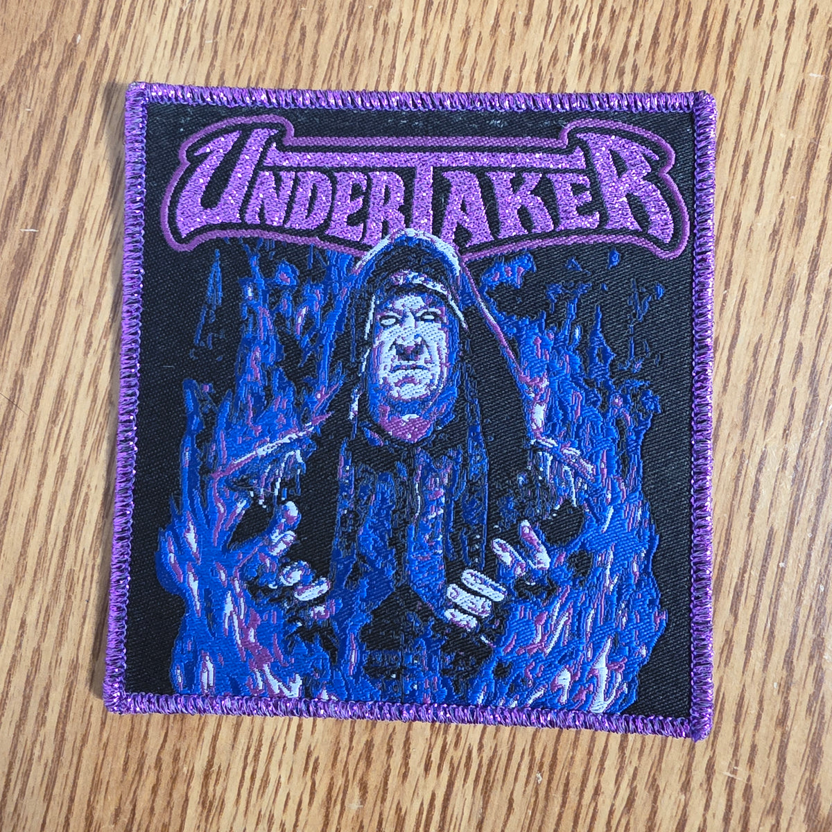 Undertaker Purple Glitter Logo